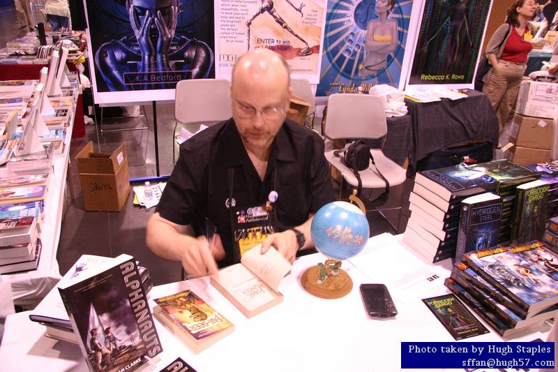 Rob Sawyer signs books at EDGE Press table