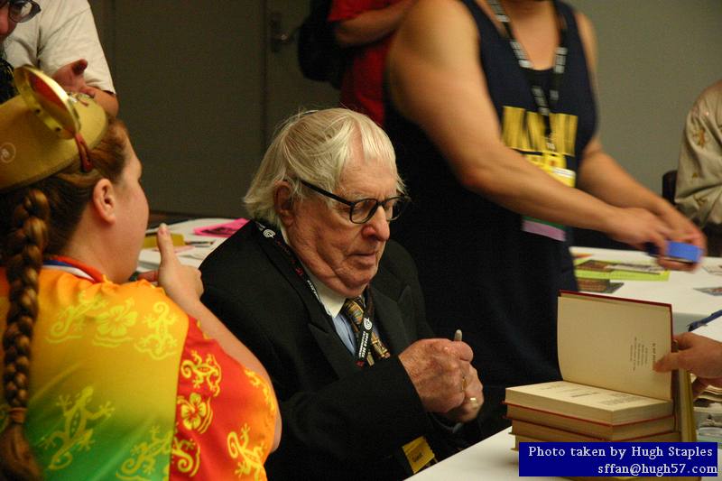 Ray Bradbury signs autographs