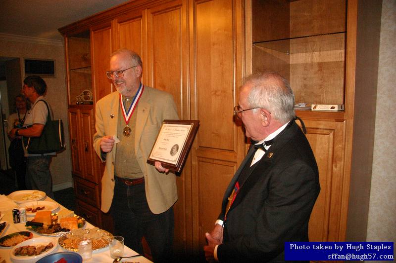 RAH Award winner is presented his award medal and plaque<br />by David Silver, President of the Heinlein Society