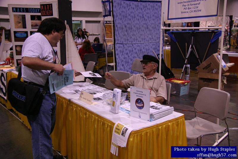 David Silver, President of the Heinlein Society, works the THS table in the Main Hall