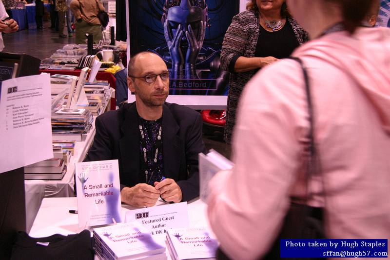 Nick DiChario signs autographs at Edge Press table
