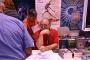 Mike Resnick signs autographs at Edge Press table