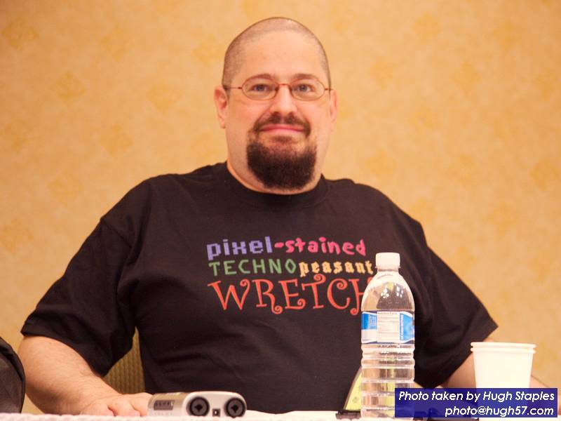 Charlie Stross shows of his t-shirt made in honor of<br />International Pixel-Stained Technopeasant Day