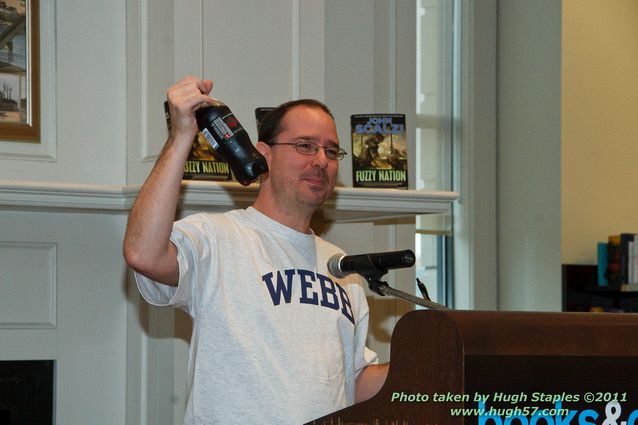 John Scalzi signs Fuzzy NationHolding up his favorite beverage.