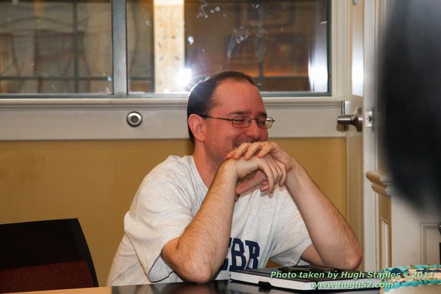 John Scalzi signs Fuzzy NationAs the crowd sings Happy Birthday.