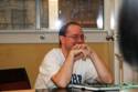 John Scalzi signs Fuzzy NationAs the crowd sings Happy Birthday.