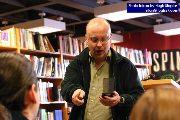 Rob Sawyer performs a passage from his new novel, MINDSCAN, before a small, but loyal and attentive crowd of about 15 people.