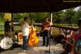 A soggy and stormy evening, but the show must go on with Ricky Nye & The Red Hots at Greenhills Summer Concerts on the Commons