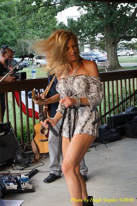 Storms threaten, but hold off long enough for the Amy Sailor Band to give a very energetic performance at Greenhills Summer Concerts on the Commons