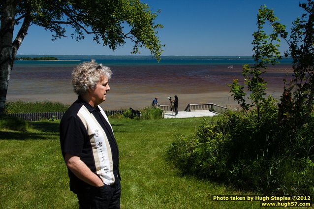 Steve Hamilton looks on as Helen Cho Anthos interviews Taylor Brugman for her documentary on the UP Book Tour