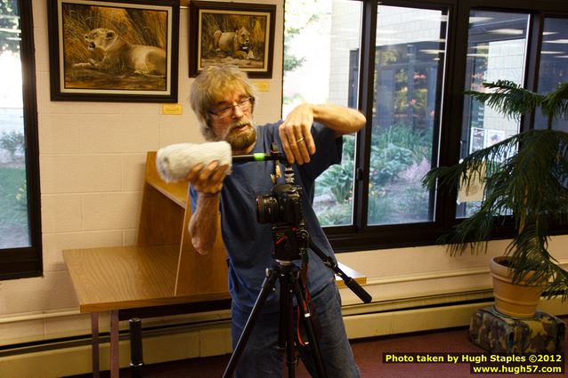 Taylor Brugman and Helen Cho Anthos prepare to interview Gordon Henry after the event.