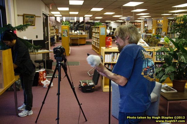 Taylor Brugman and Helen Cho Anthos prepare to interview Gordon Henry after the event.