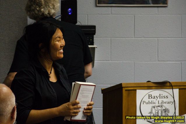 Helen Cho Anthos receives a gift of autographed books at the Bayliss Library event of the UP Book Tour.