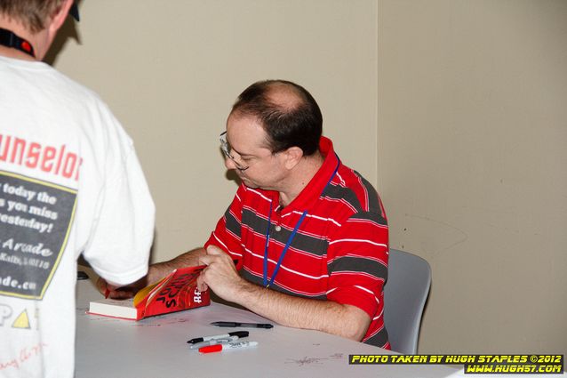 John Scalzi signs books for his fans.